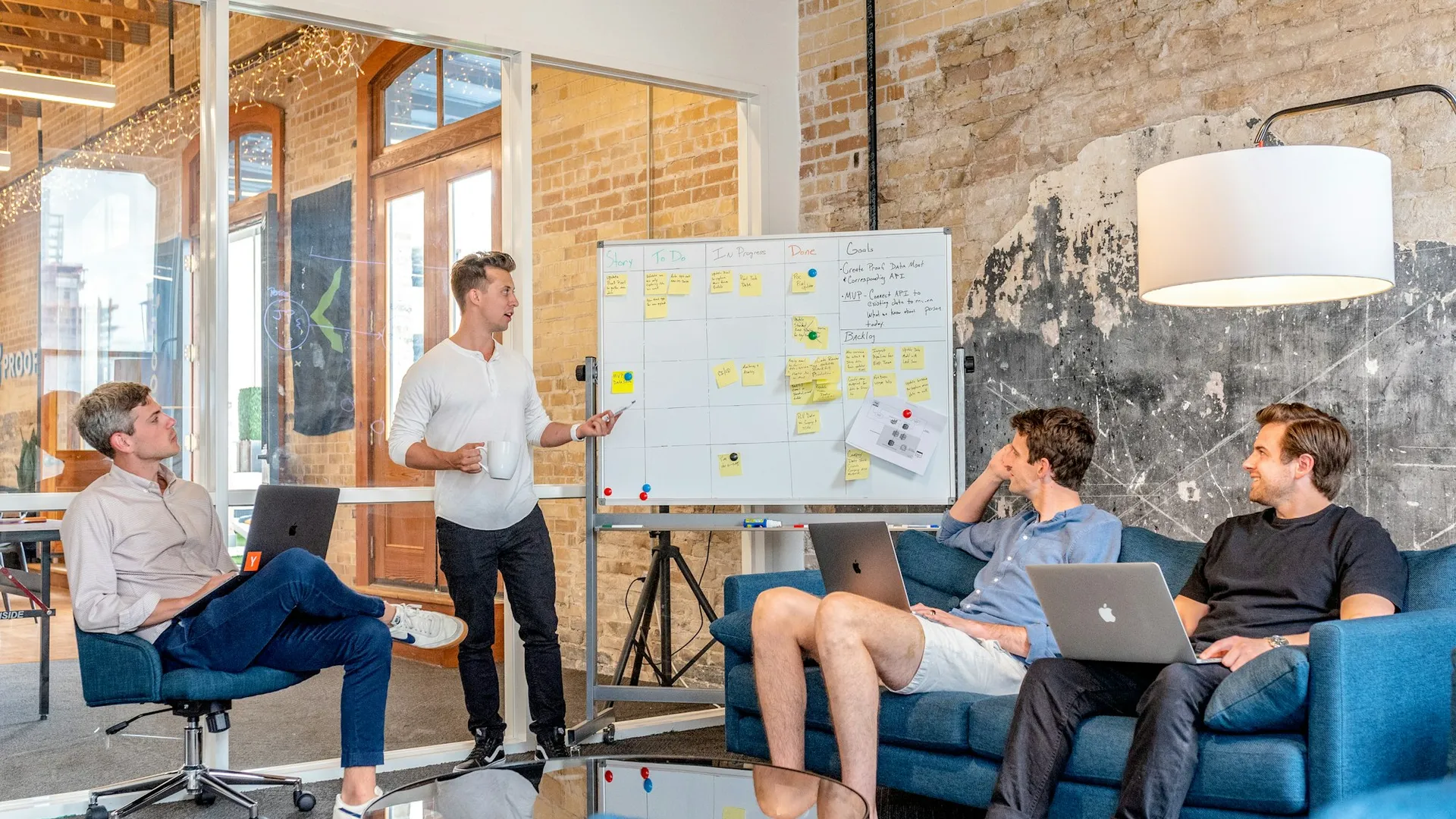 Team brainstorming at a whiteboard in an office