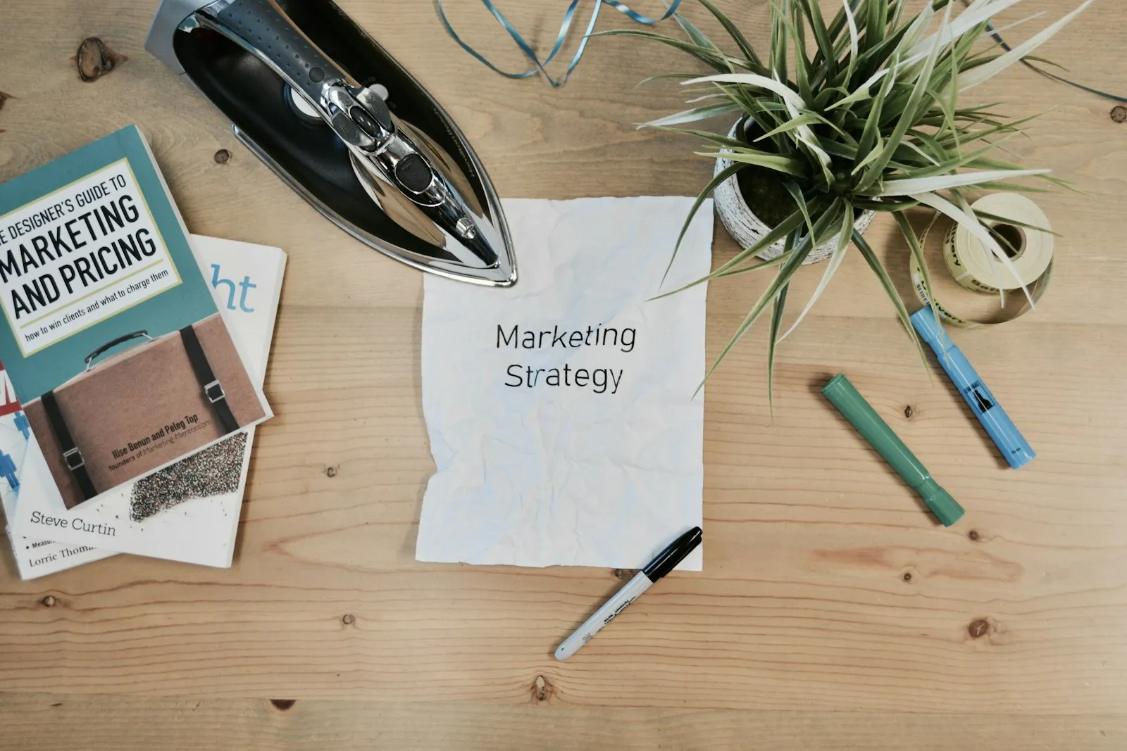 Marketing strategy notes and books on a desk